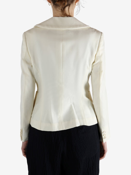 White jacket worn by a person, showing the jacket's fit