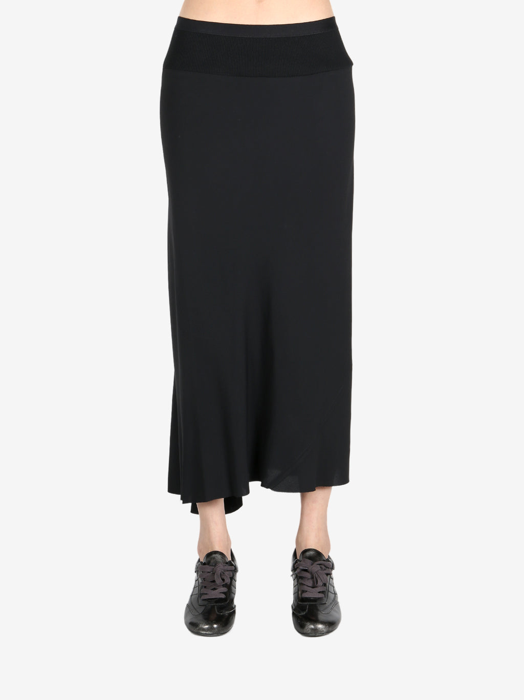 Black skirt worn by a person, showing the skirt's fit