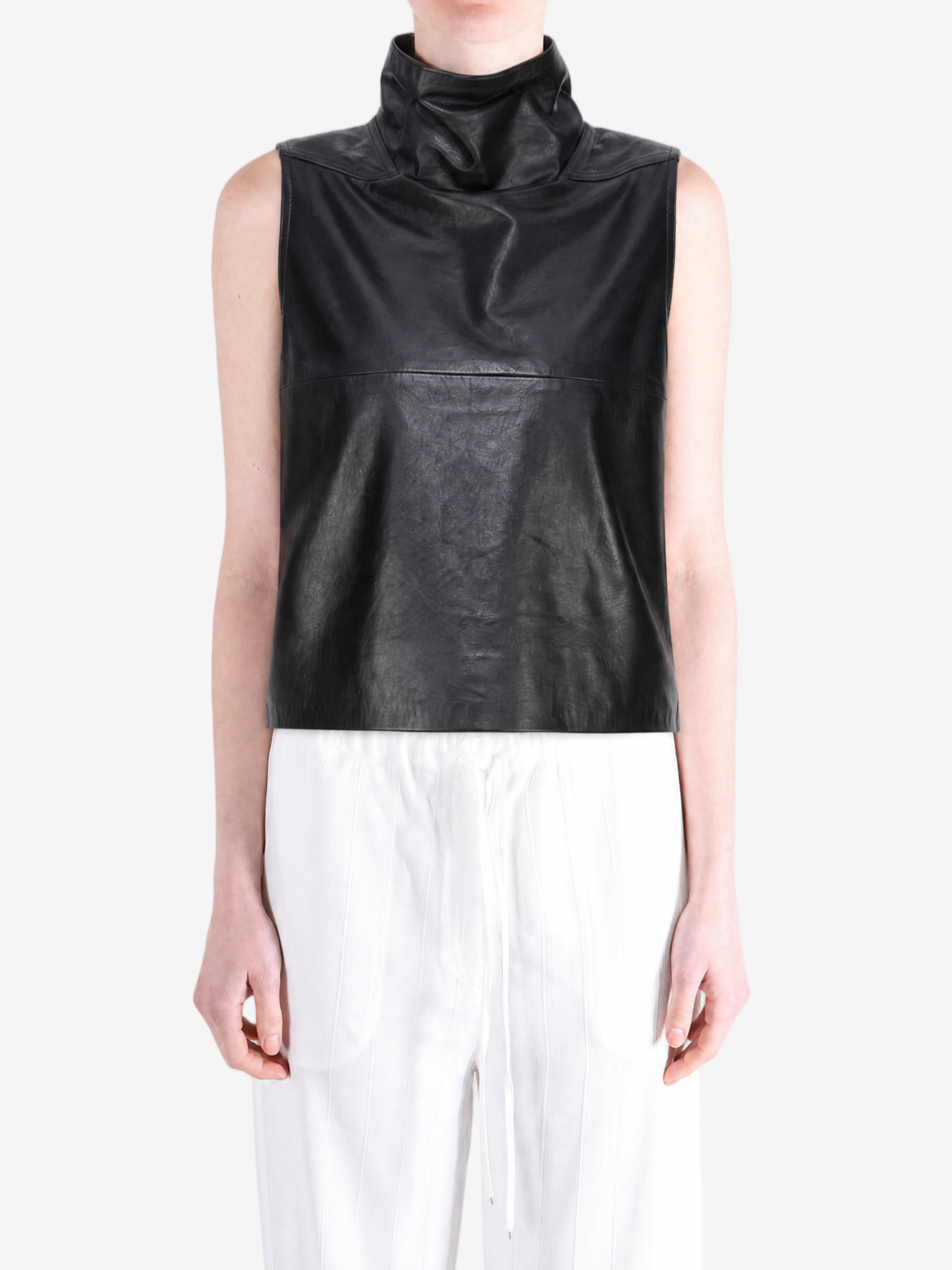 Black tops worn by a person, showing the  tops  fit