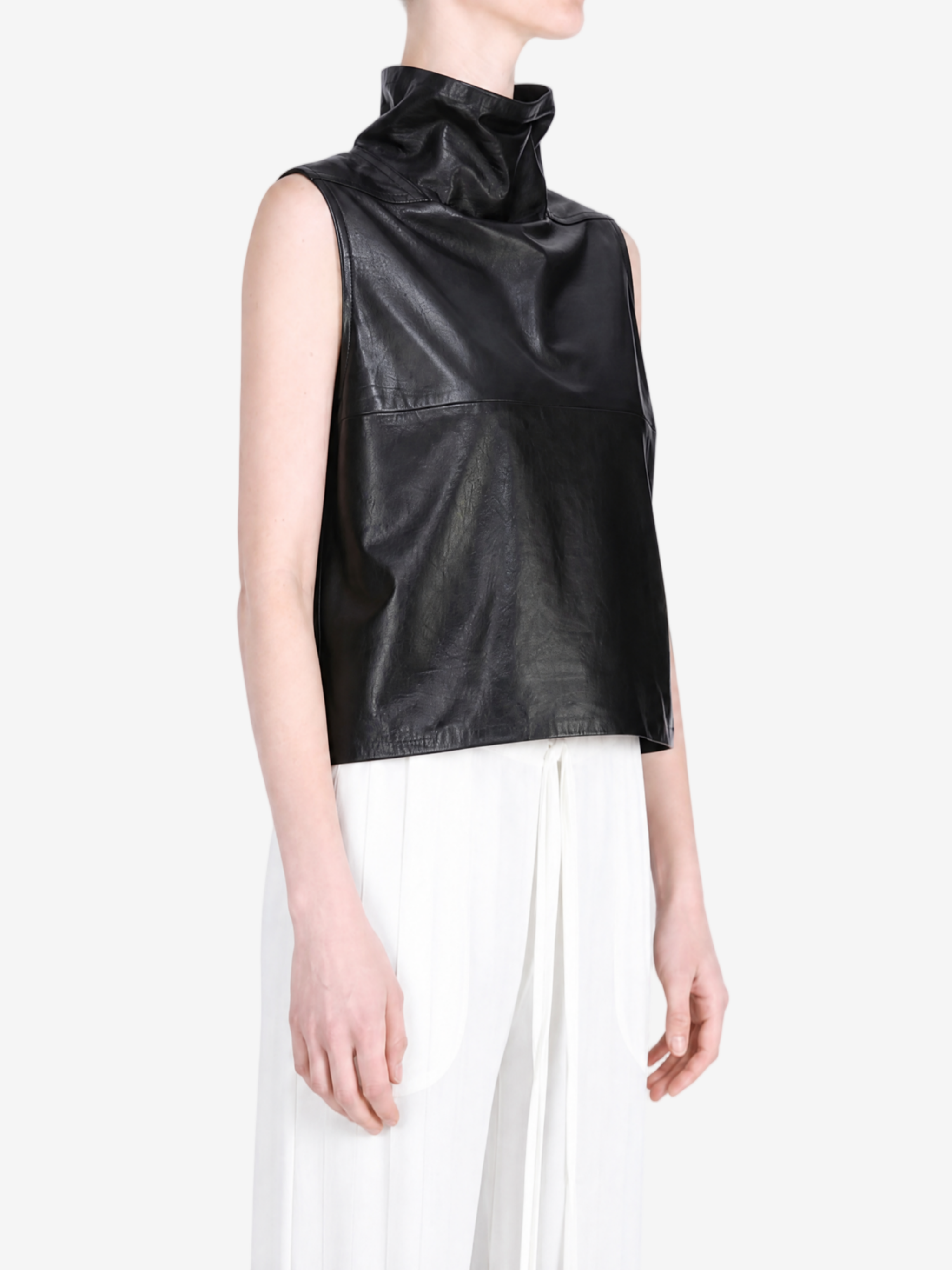 Black tops worn by a person, showing the  tops  fit