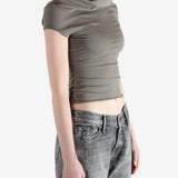 Grey t-shirts worn by a person, showing the t-shirt's fit