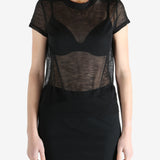 Black t-shirt worn by a person, showing the shirt's fit