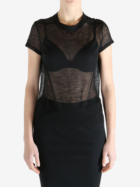 Black t-shirt worn by a person, showing the shirt's fit