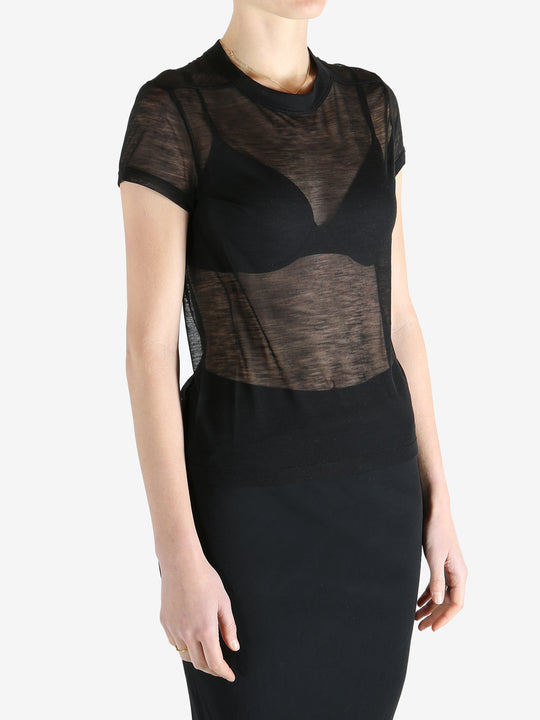 Black t-shirt worn by a person, showing the shirt's fit