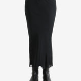 Black skirt worn by a person, showing the skirt fit