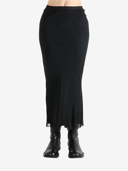 Black skirt worn by a person, showing the skirt fit