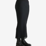 Black skirt worn by a person, showing the skirt fit