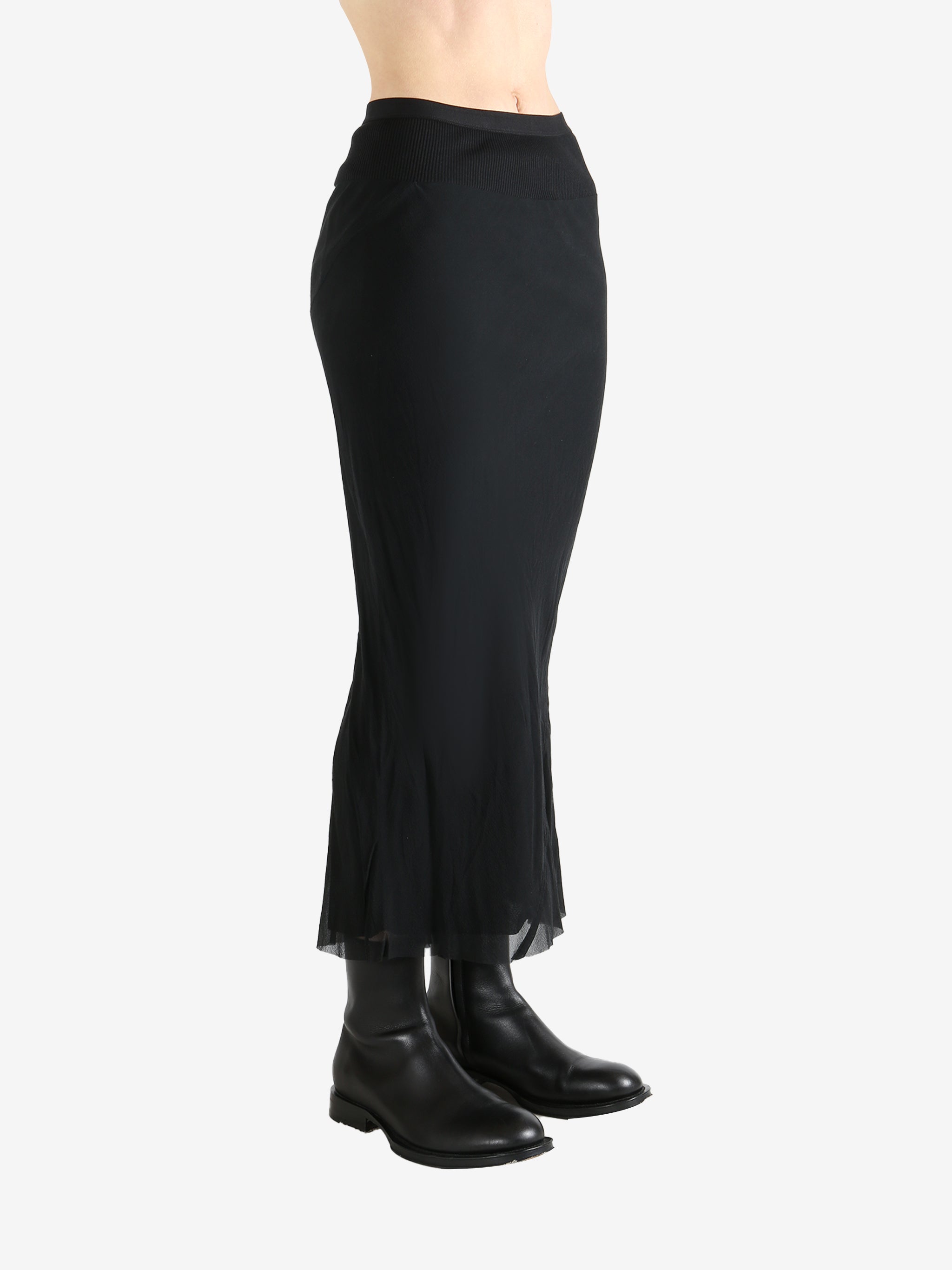 Black skirt worn by a person, showing the skirt fit