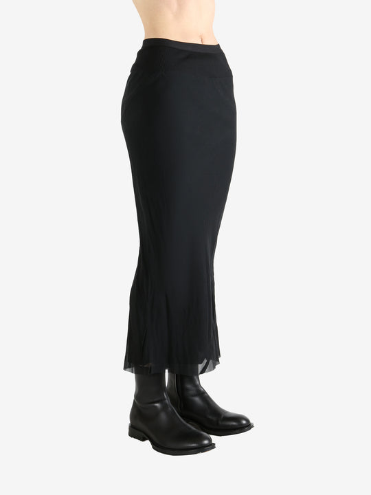 Black skirt worn by a person, showing the skirt fit