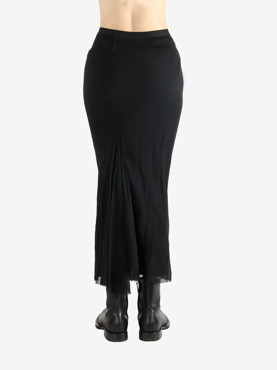 Black skirt worn by a person, showing the skirt fit