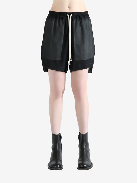 Black shorts worn by a person, showing the shorts fit