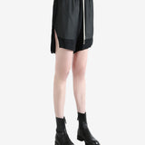 Black shorts worn by a person, showing the shorts fit