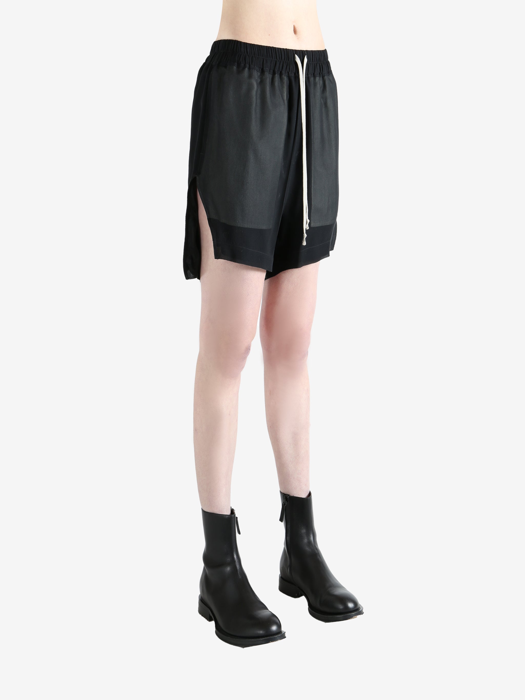 Black shorts worn by a person, showing the shorts fit