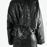 Black jacket  worn by a person, showing the jacket 's fit