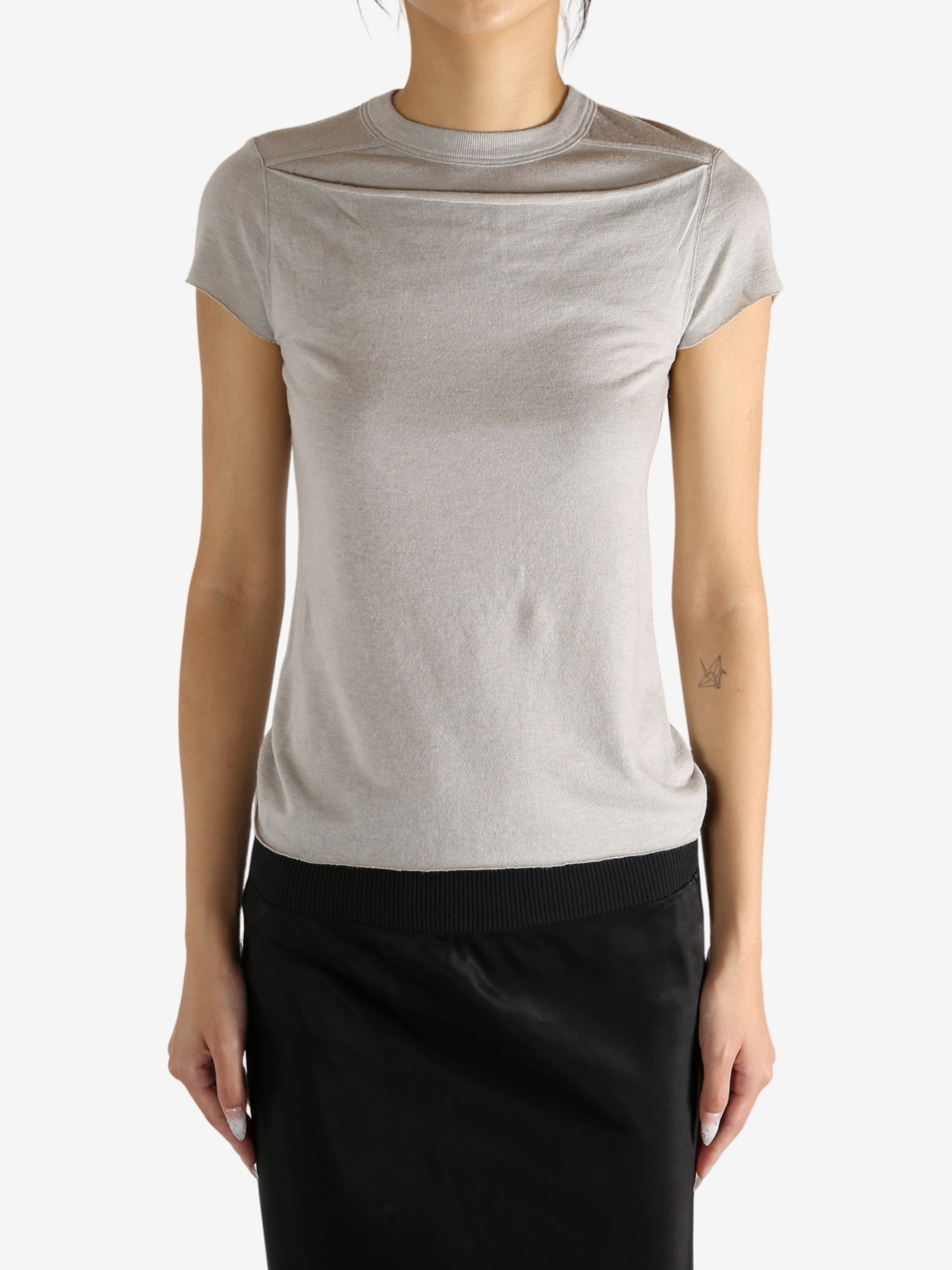 Grey t-shirt worn by a person,showing the t-shirt's fit