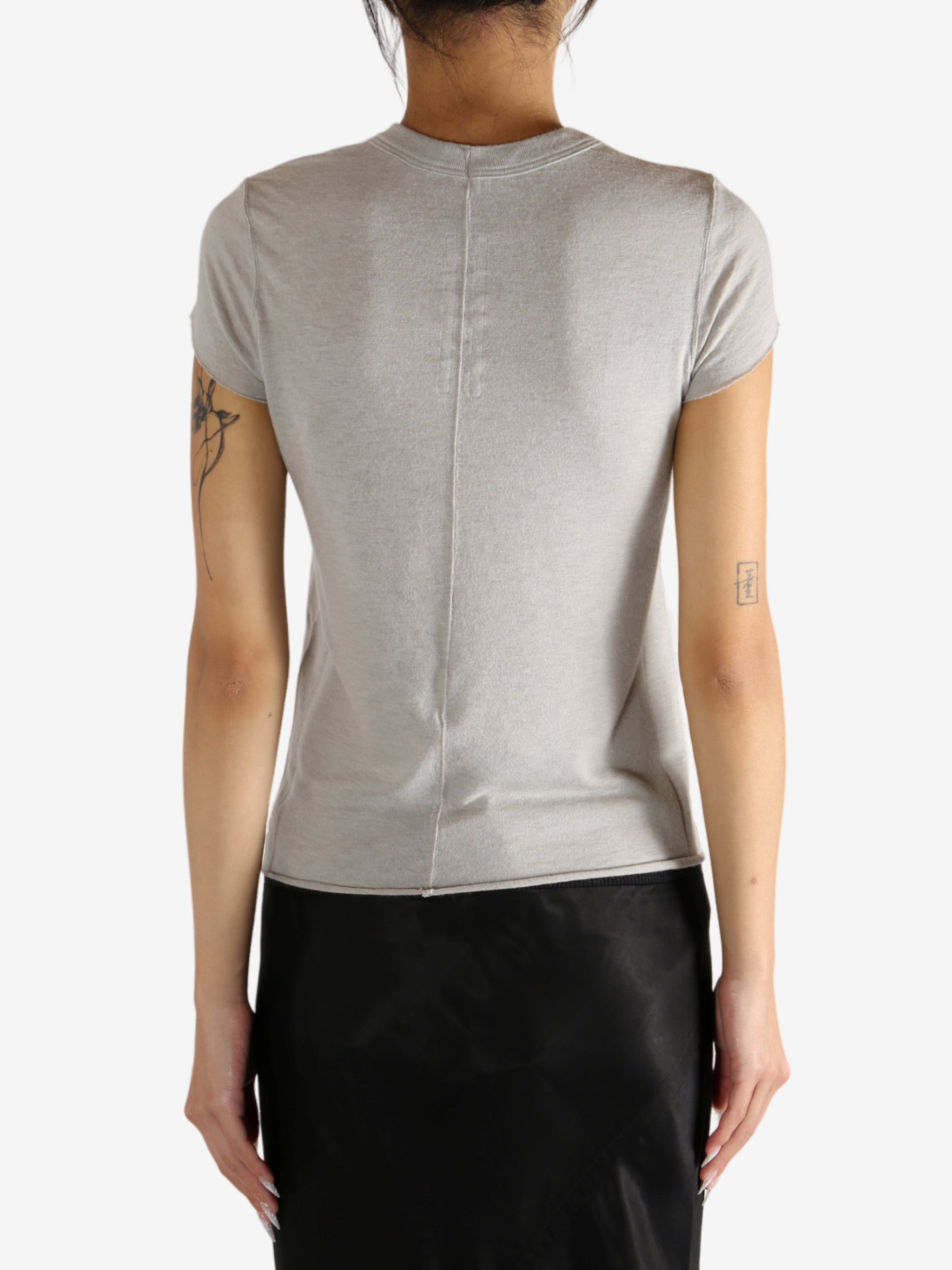 Grey t-shirt worn by a person,showing the t-shirt's fit