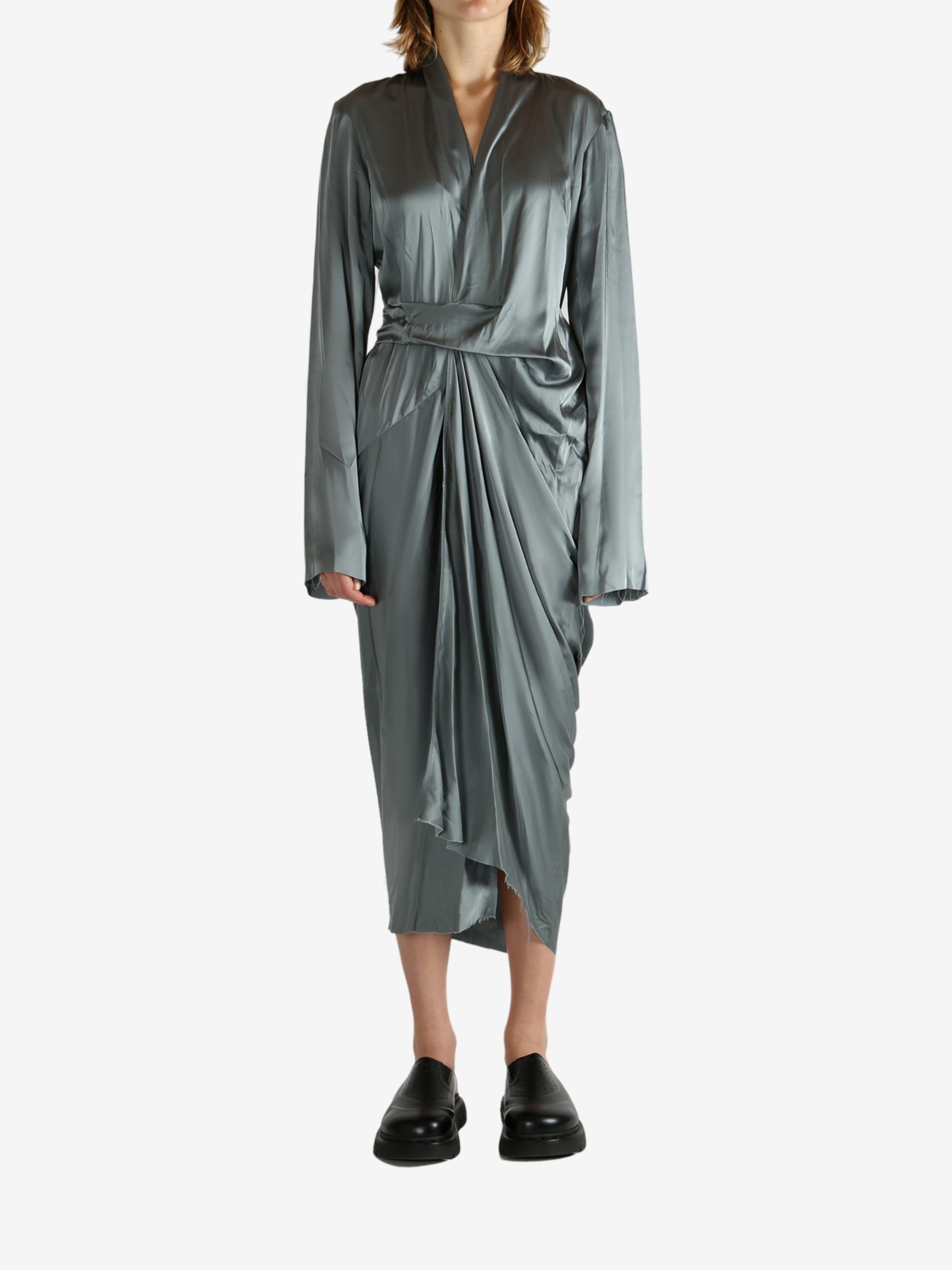 Grey dress worn by a person, showing the dreess' fit