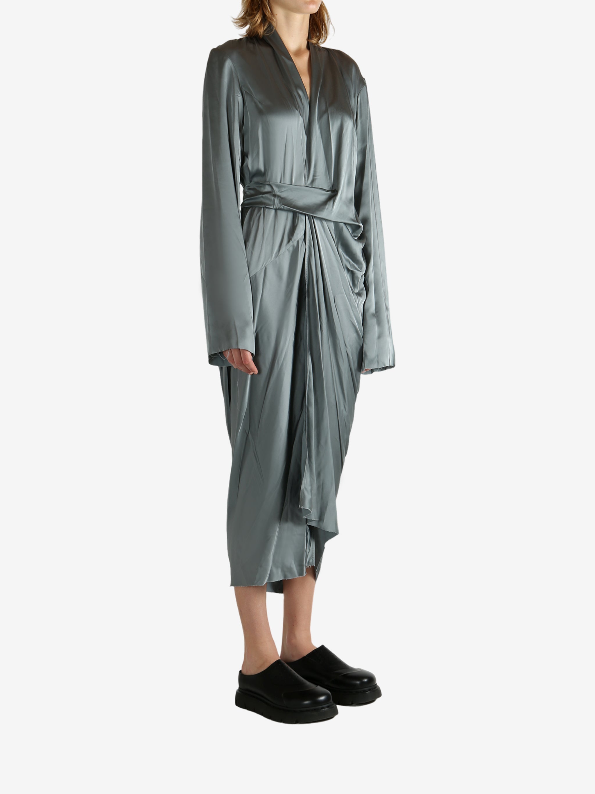 Grey dress worn by a person, showing the dreess' fit