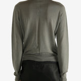 Grey knitwear worn by a person,showing the knitwear's fit