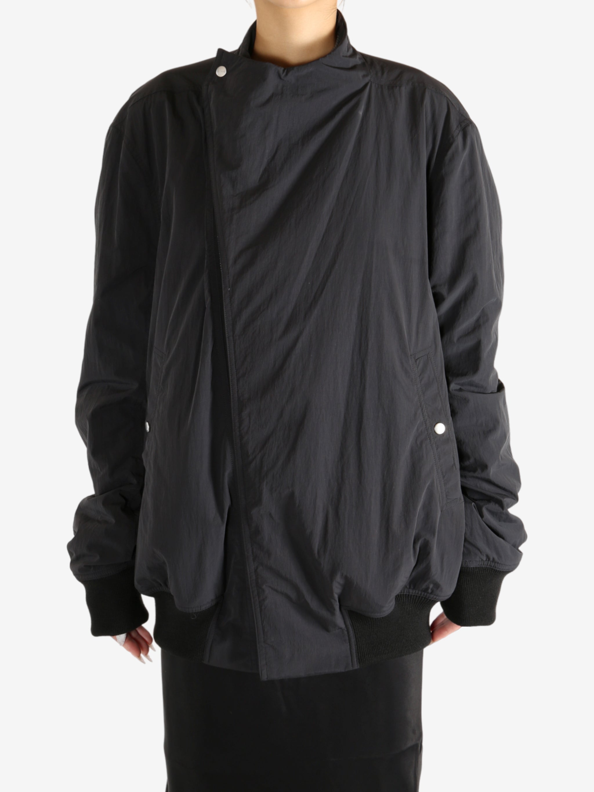 Black jacket worn by a person,showing the jacket's fit