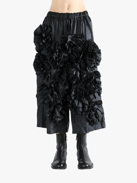 Black pant  worn by a person, showing the pant 's fit