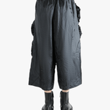 Black pant  worn by a person, showing the pant 's fit