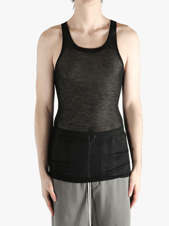 black tops worn by a person, showing the  tops fit