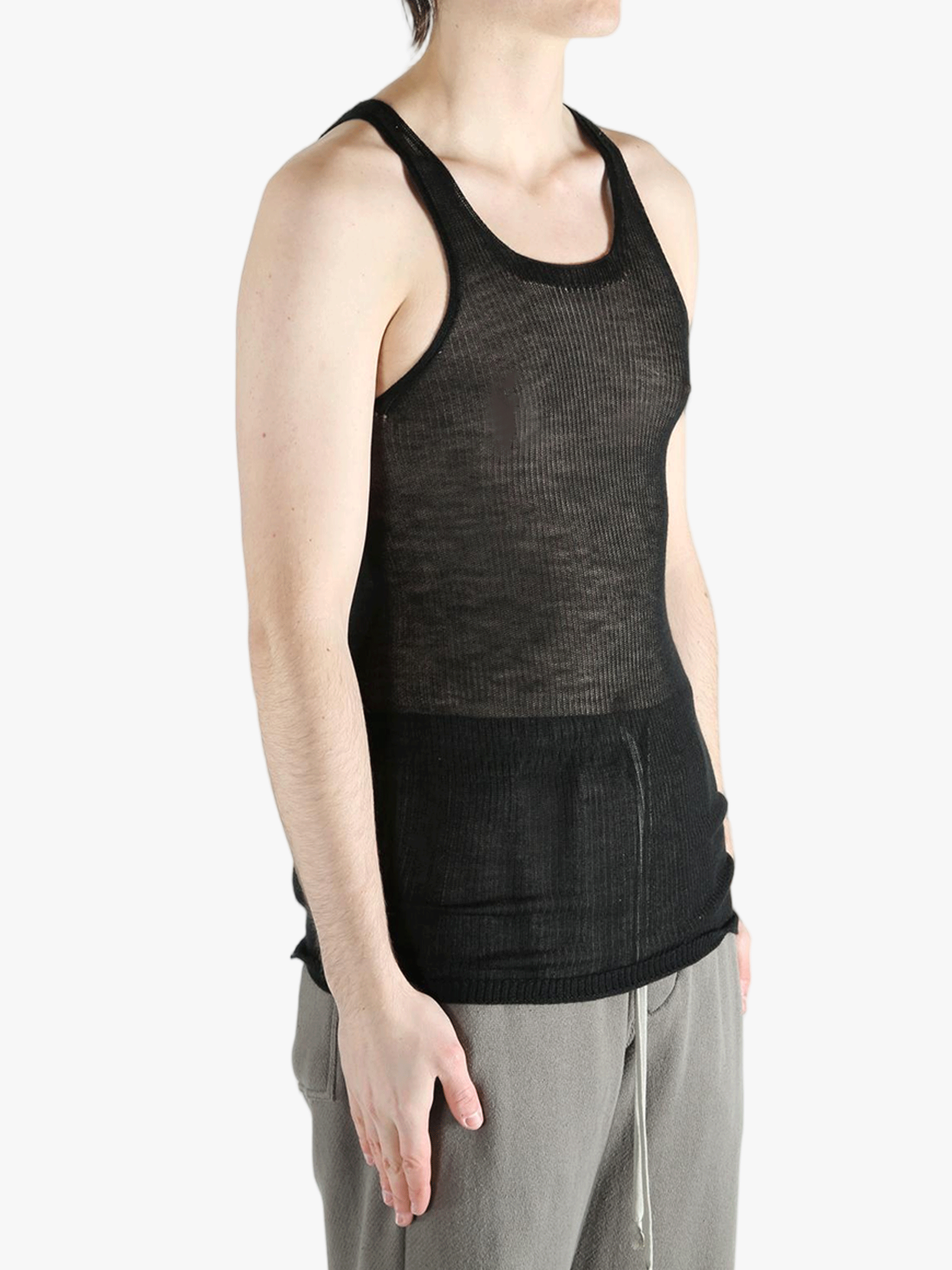 black tops worn by a person, showing the  tops fit