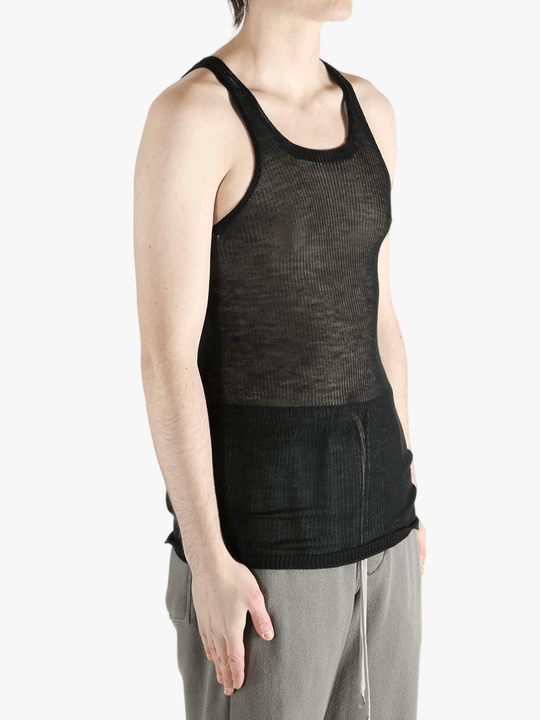 black tops worn by a person, showing the  tops fit