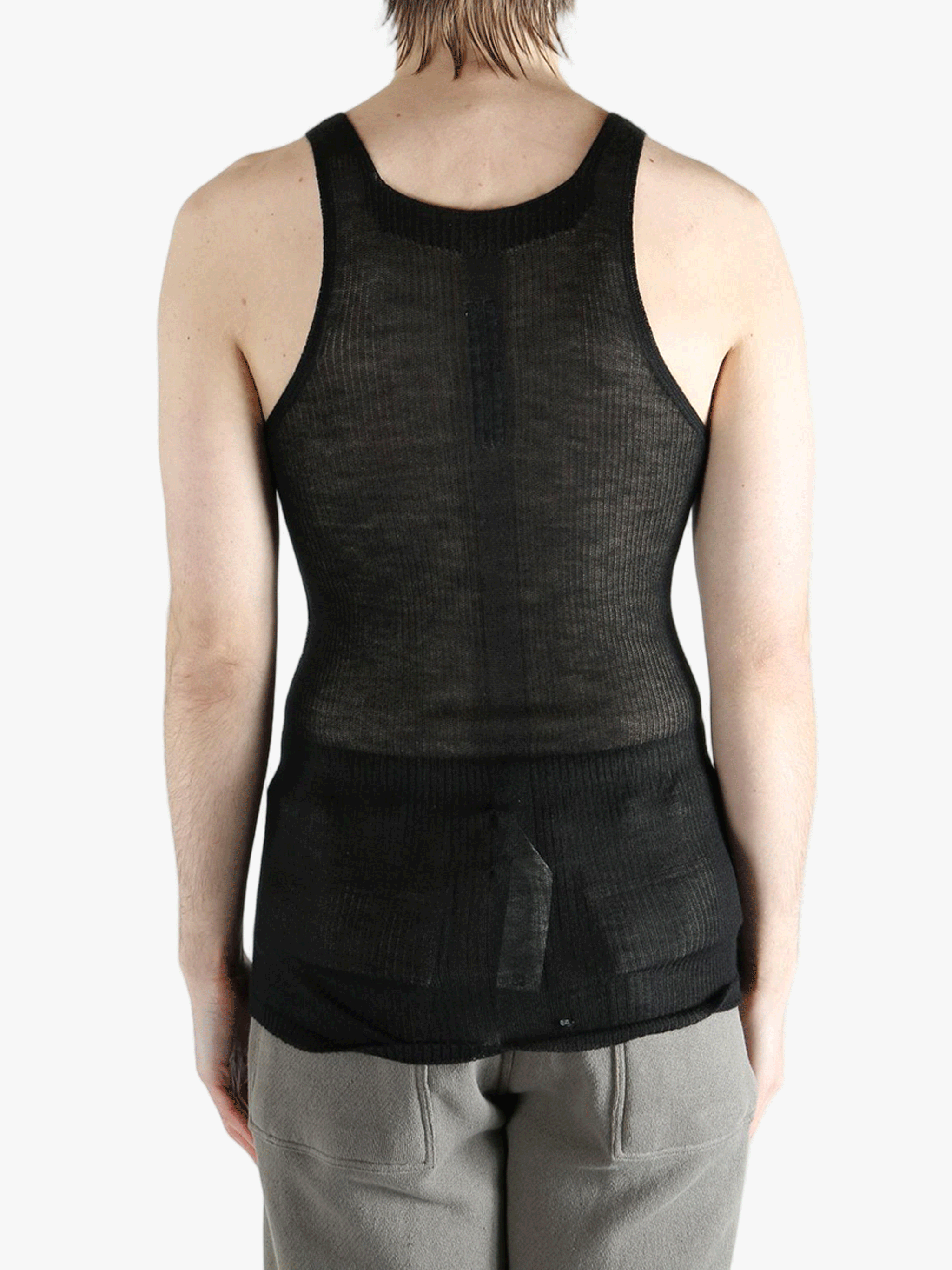 black tops worn by a person, showing the  tops fit