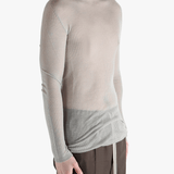 gray tops worn by a person, showing the tops fit