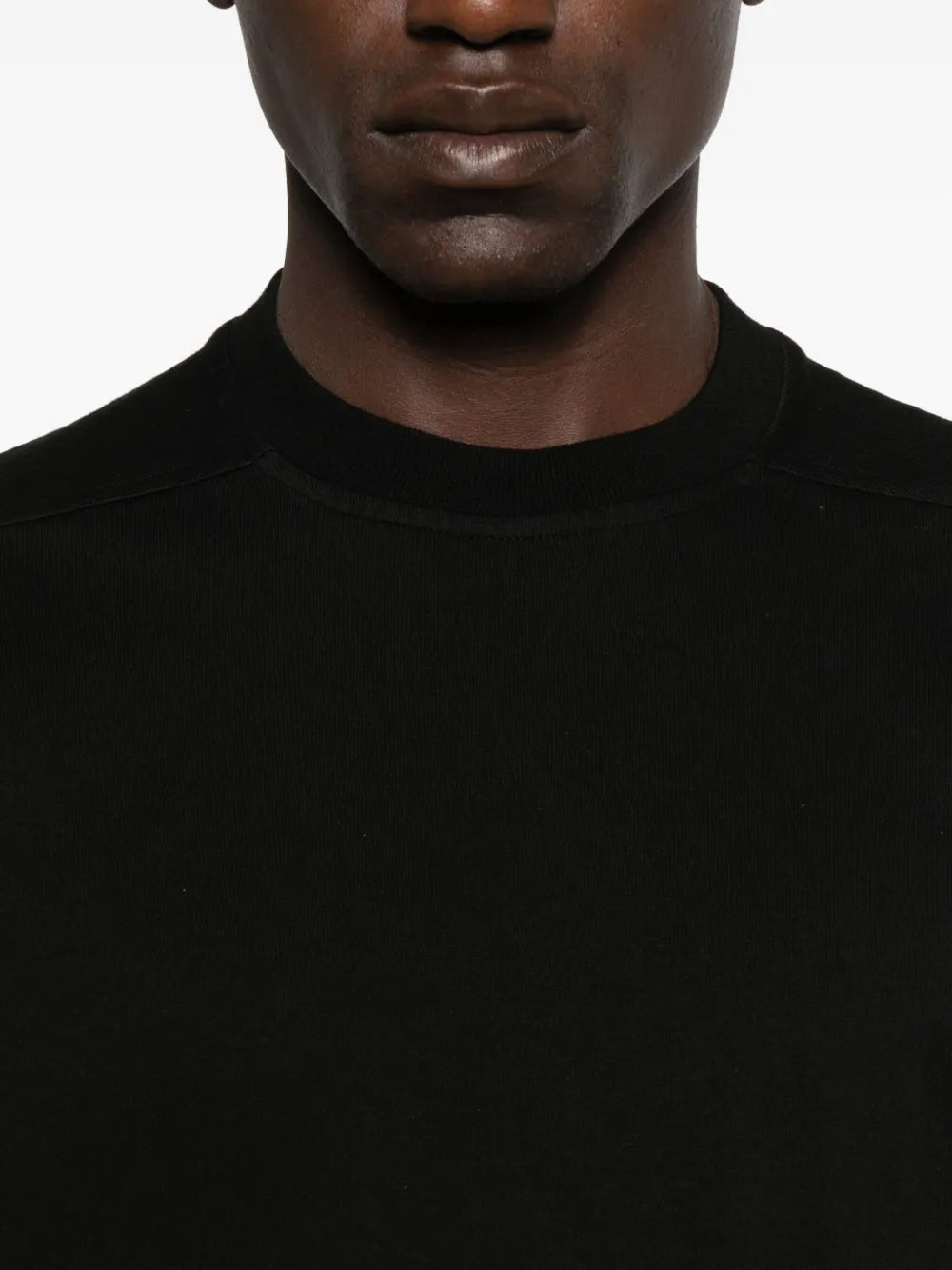Close up of black t-shirt,showing texture of the cotton fabric.
