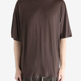 brown t-shirt worn by a person, showing the t-shirt fit
