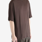 brown t-shirt worn by a person, showing the t-shirt fit