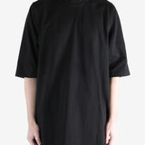 black t-shirt worn by a person, showing the t-shirt  fit