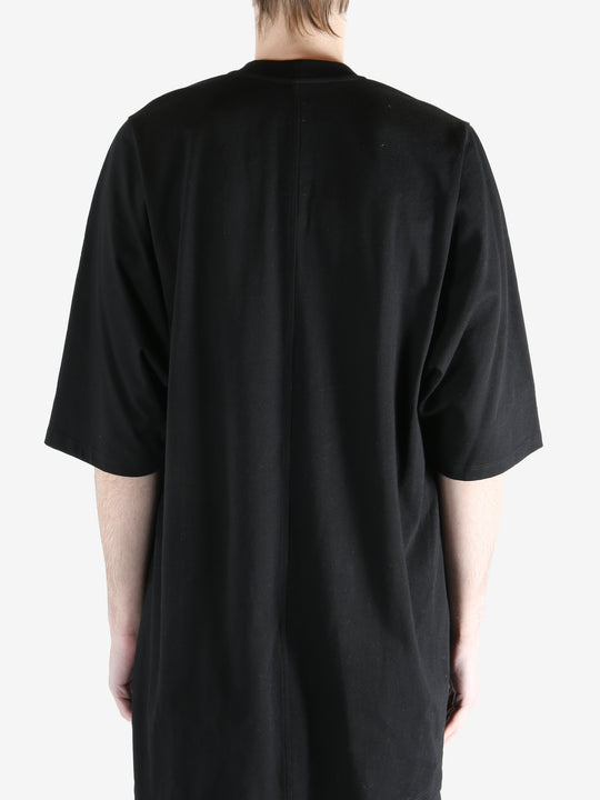 black t-shirt worn by a person, showing the t-shirt  fit