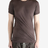Brown t-shirt worn by a person, showing the t-shirt fit