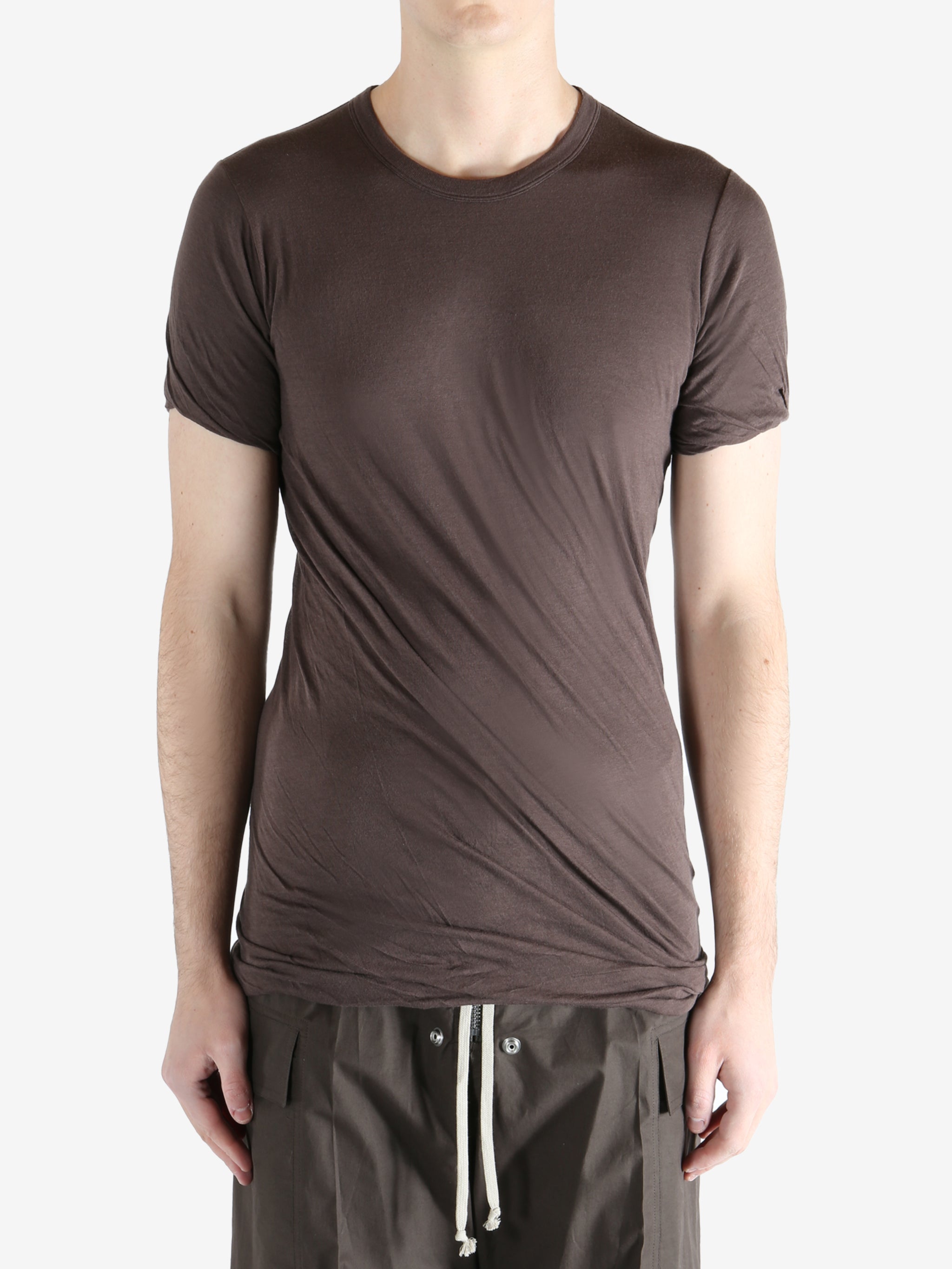 Brown t-shirt worn by a person, showing the t-shirt fit