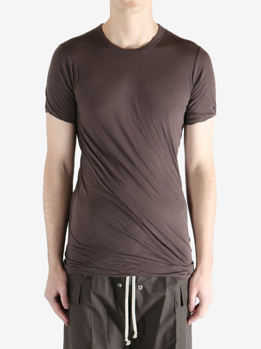Brown t-shirt worn by a person, showing the t-shirt fit