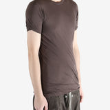 Brown t-shirt worn by a person, showing the t-shirt fit