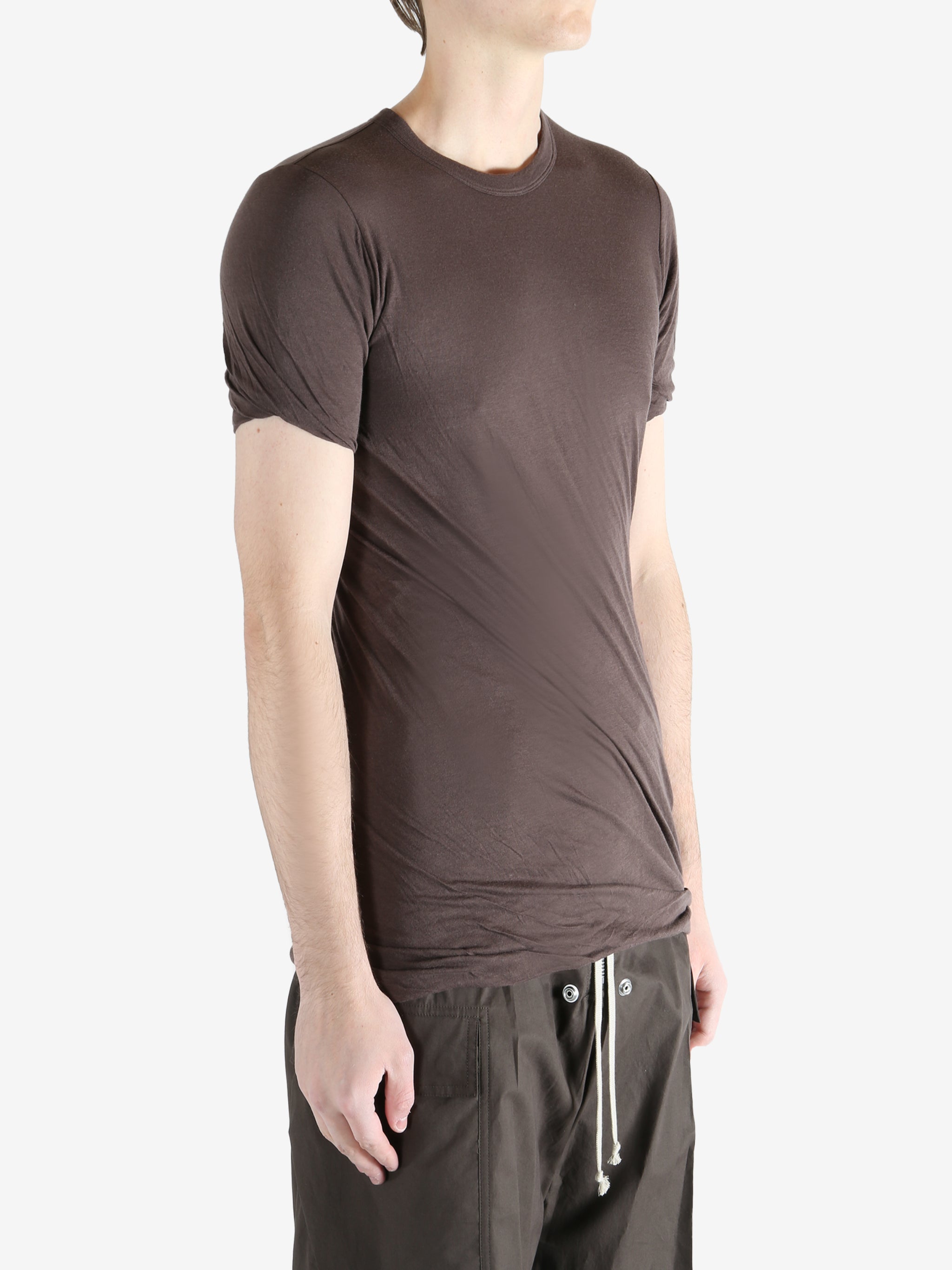 Brown t-shirt worn by a person, showing the t-shirt fit