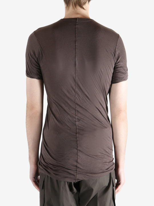 Brown t-shirt worn by a person, showing the t-shirt fit