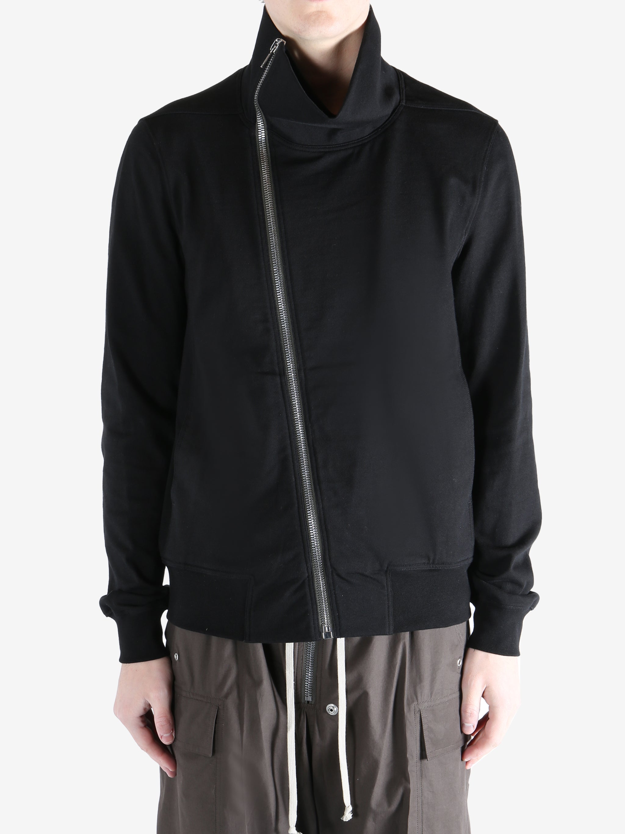 Black jacket worn by a person, showing the jacket fit