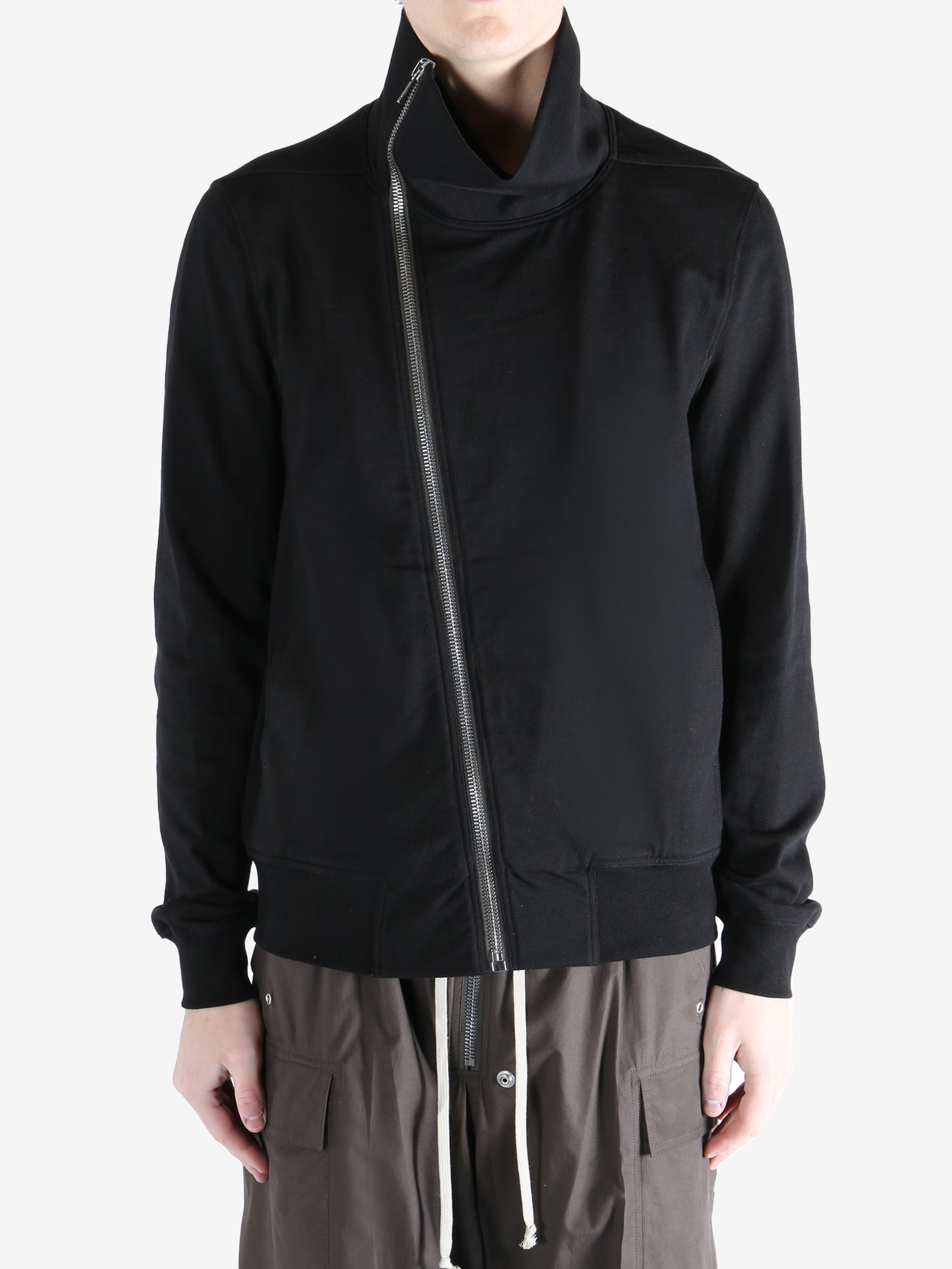 Black jacket worn by a person, showing the jacket fit