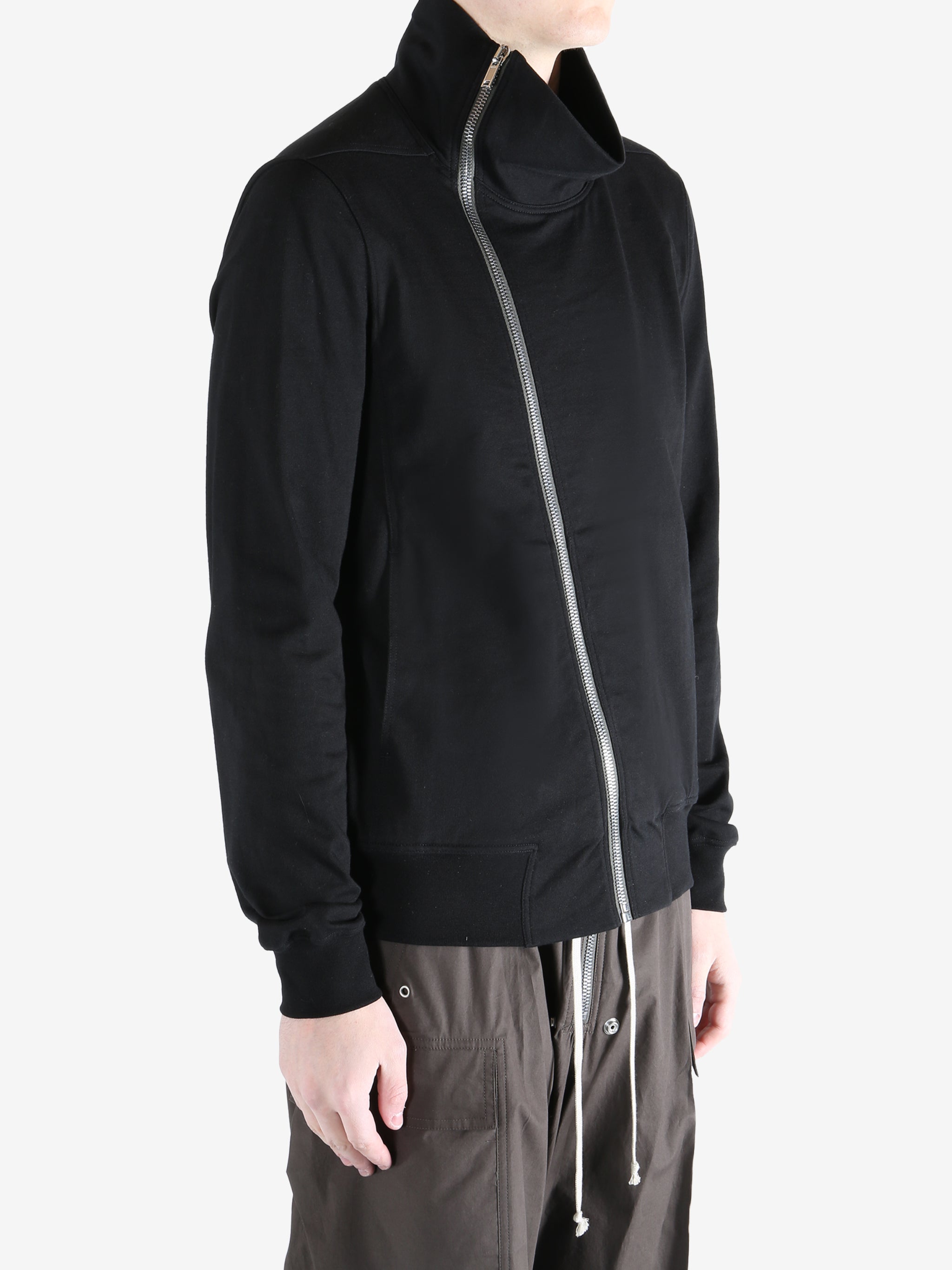 Black jacket worn by a person, showing the jacket fit