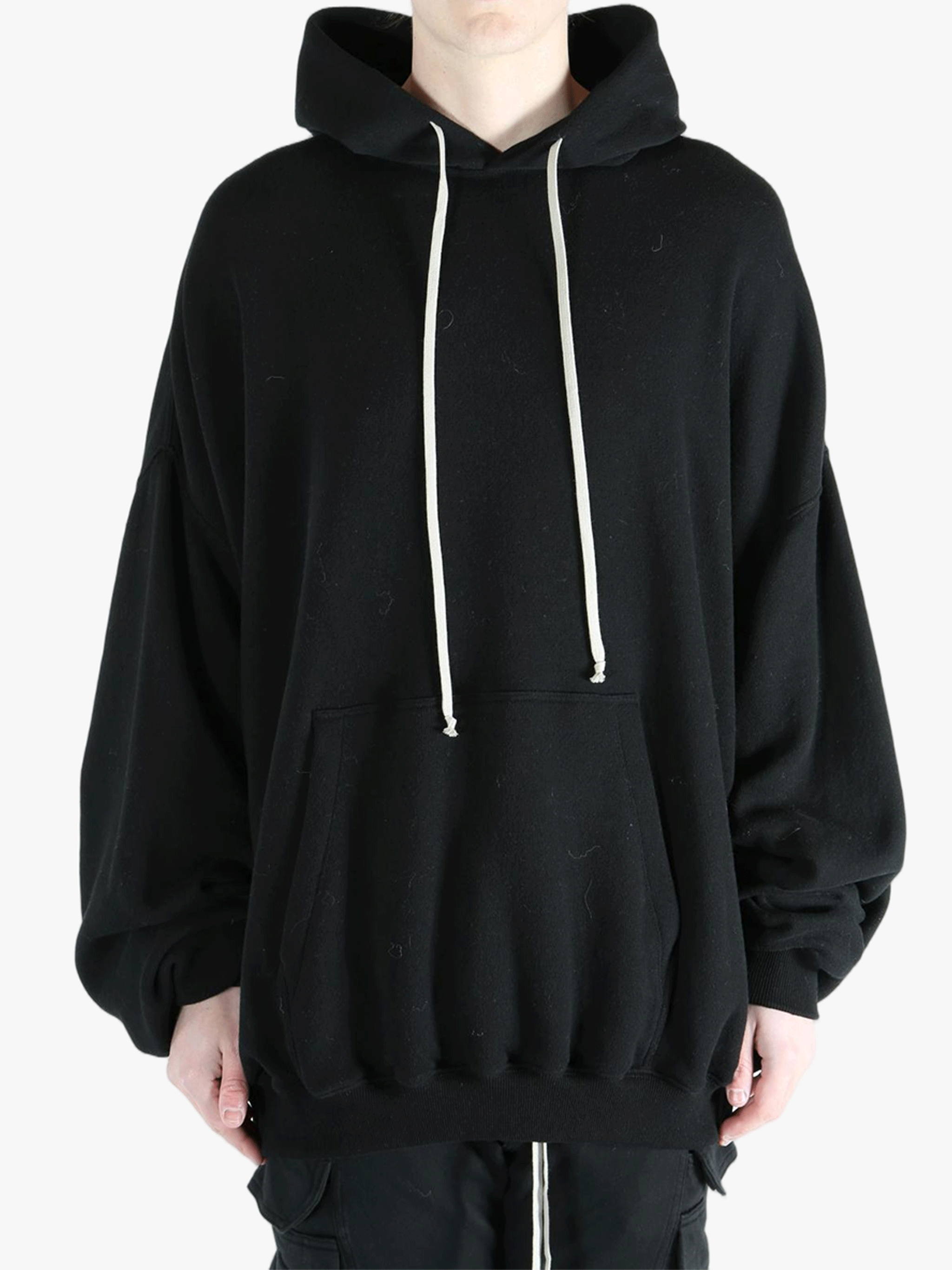 Black hoodies worn by a person, showing the hoodies fit