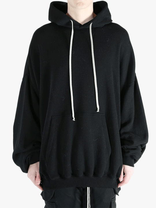 Black hoodies worn by a person, showing the hoodies fit