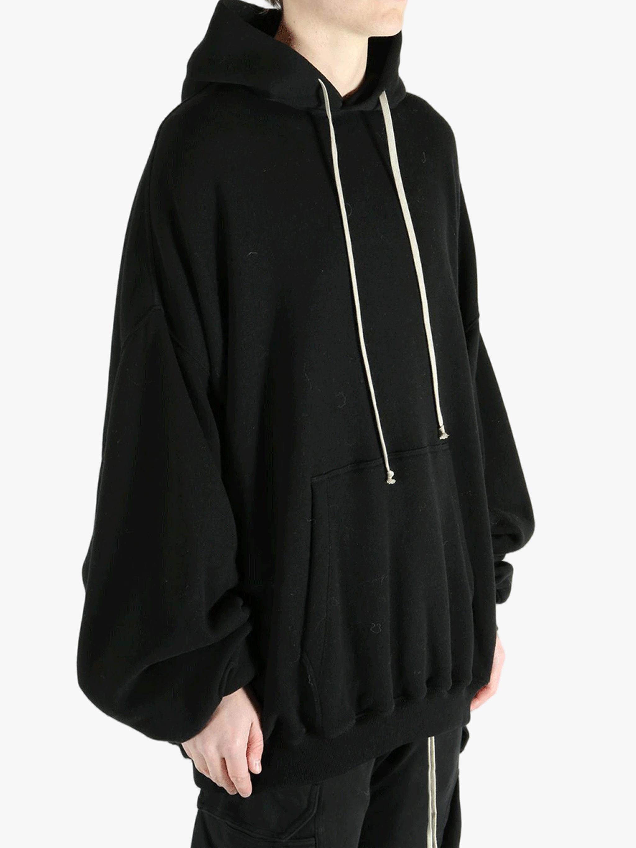 Black hoodies worn by a person, showing the hoodies fit