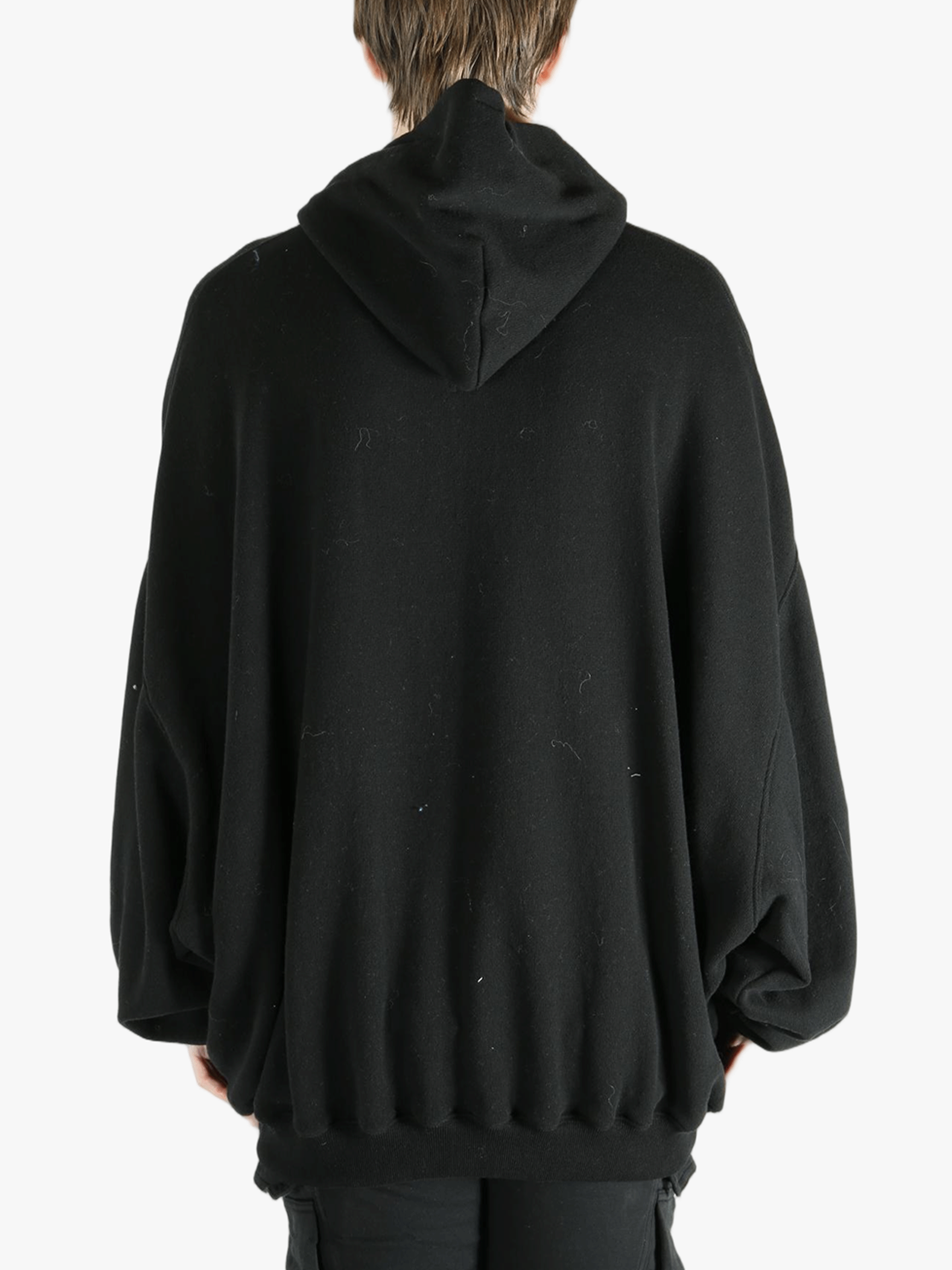 Black hoodies worn by a person, showing the hoodies fit