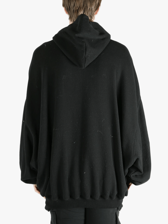 Black hoodies worn by a person, showing the hoodies fit